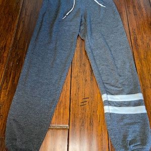 Grey sweatpants. Joggers cinched ankles. Sweats.